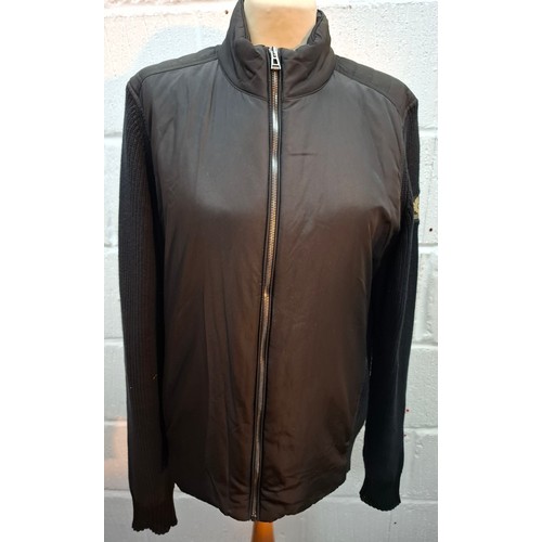 19 - Belstaff- A gents black casual jacket having knitted sleeves and back and a padded, waterproof front... 