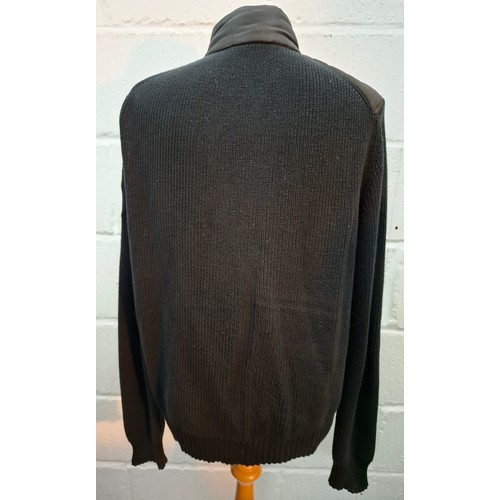 19 - Belstaff- A gents black casual jacket having knitted sleeves and back and a padded, waterproof front... 