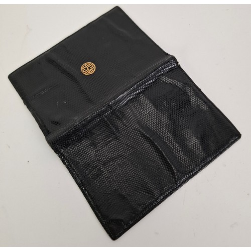 17 - Asprey- A pre-1970's black leather snakeskin wallet with the initials NSG within a circle in yellow ... 