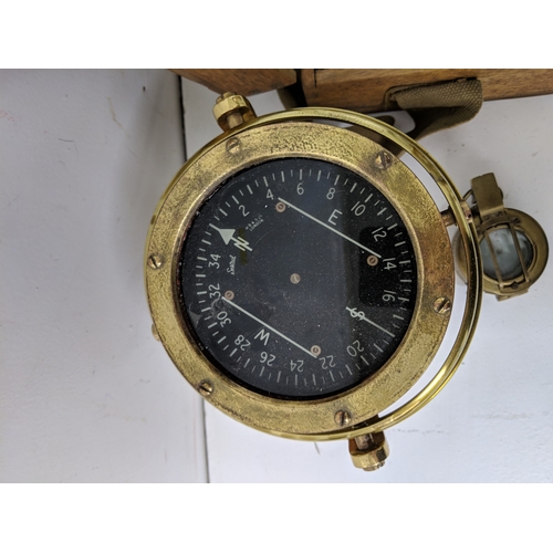 2 - Three compasses to include a pocket example, a cased example and another on a swing swivel base
Loca... 