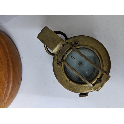 2 - Three compasses to include a pocket example, a cased example and another on a swing swivel base
Loca... 
