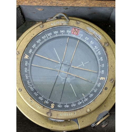 2 - Three compasses to include a pocket example, a cased example and another on a swing swivel base
Loca... 