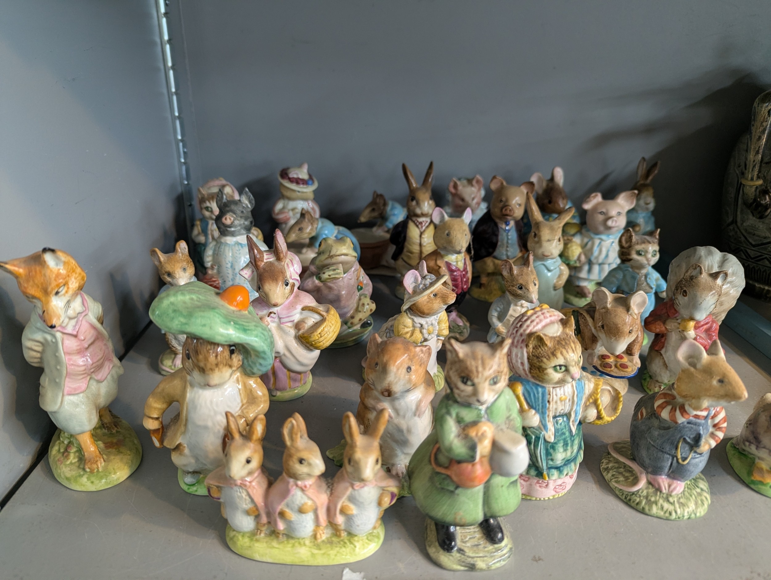 A collection of Beswick Beatrix Potter figurines, some examples with ...