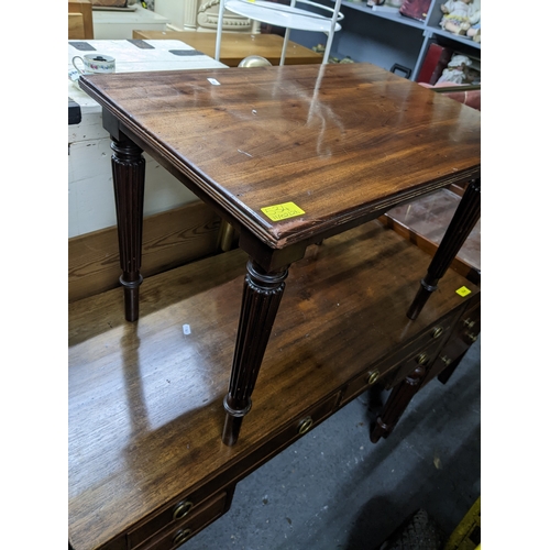 534 - A Victorian tray top style mahogany bedside chest of three drawers with brass handles, glass top, on... 