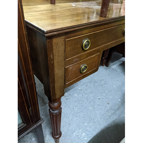 534 - A Victorian tray top style mahogany bedside chest of three drawers with brass handles, glass top, on... 