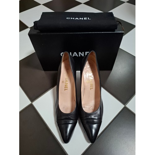 Chanel- A pair of black leather court shoes, made in France, European size 38.5, 3" kitten heel with branded dust bag and box. Location: