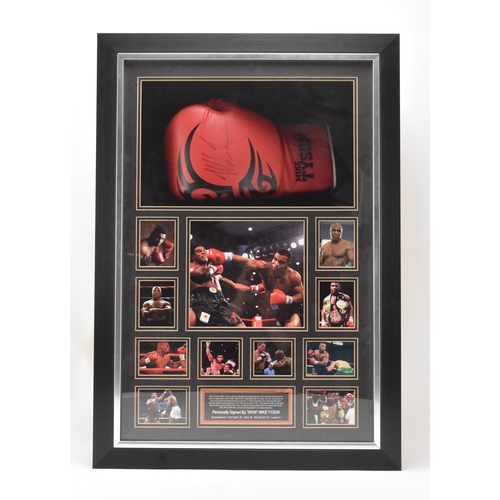 174 - Boxing Memorabilia: A boxing glove signed by Mike Tyson, set within a frame, bears certificate of Au... 