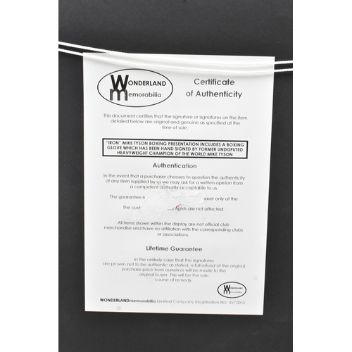 174 - Boxing Memorabilia: A boxing glove signed by Mike Tyson, set within a frame, bears certificate of Au... 