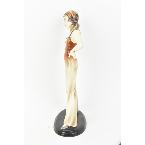 6 - Stefan Dakon (Austrian, 1904–1992) for Goldscheider - An Art Deco ceramic figure of a sailor girl, w... 