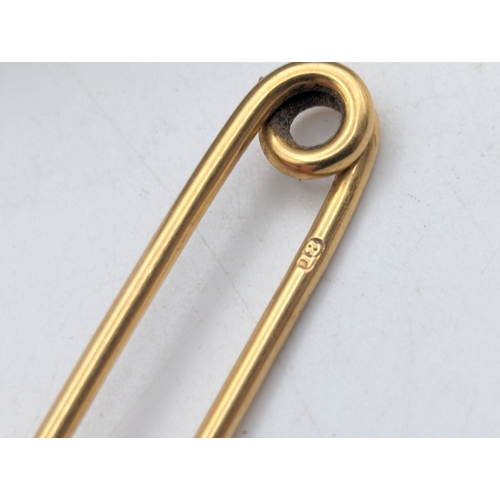 12 - An 18ct yellow gold bar brooch stamped 18, weight 4g, 5cm L
Location: C1
If there is no condition re... 