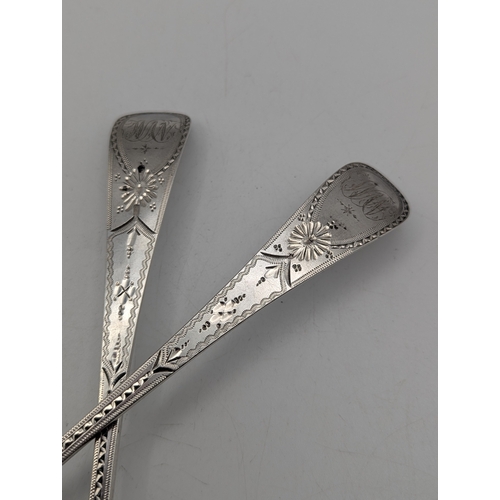 23 - A pair of George III silver tablespoons with decorative handles and initials to the terminals hallma... 