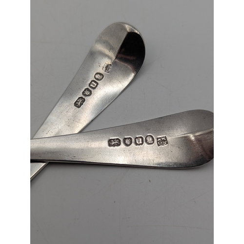 23 - A pair of George III silver tablespoons with decorative handles and initials to the terminals hallma... 
