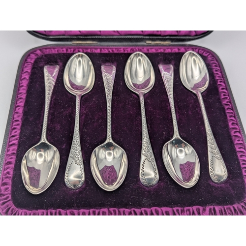 26 - A set of six Victorian silver teaspoon with decorative engraved terminals, hallmarked London 1888 in... 