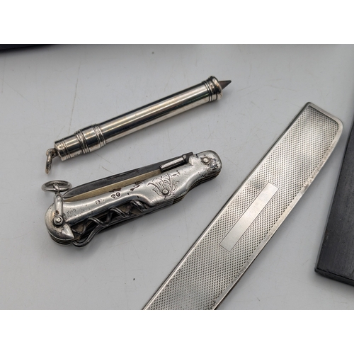 32 - Mixed collectables to include a silver cased propelling pencil, a silver front and back pocket utili... 