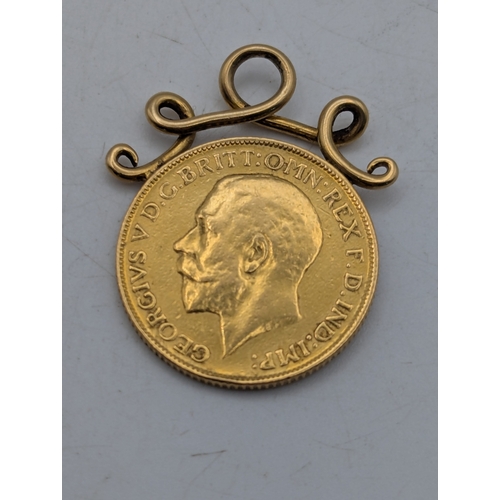 35 - A 1911 gold Sovereign attached to a yellow metal gold scroll-style suspension loop 9.4g Location: C1... 