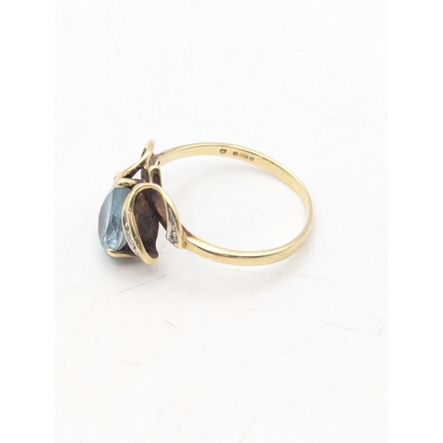 48 - A 14ct yellow gold ring set with a pear cut topaz and diamonds, size T, 3.8g
Location: R1
If there i... 