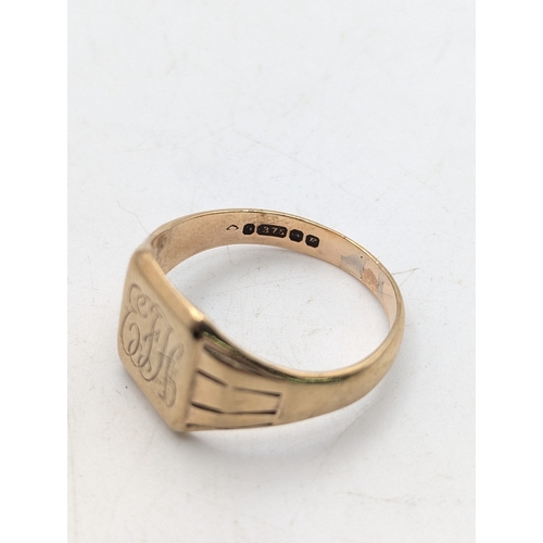 8 - A 9ct yellow gold signet ring engraved with initials EFH with a tapering shank, stamped 375 with Bri... 