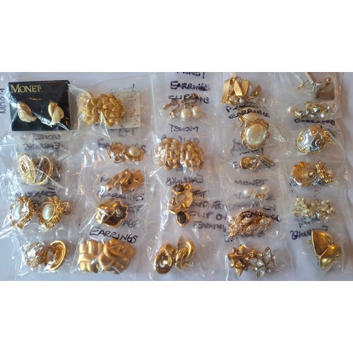 29 - Monet- A collection of 1980's and 90's gold tone costume jewellery to include 5 brooches, simulated ... 