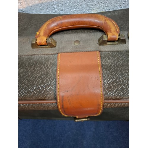 9 - Mulberry- A vintage suitcase in mole Scotchgrain and tan saddle leather trim and handles with wheels... 
