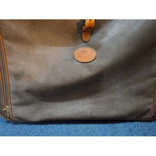 9 - Mulberry- A vintage suitcase in mole Scotchgrain and tan saddle leather trim and handles with wheels... 