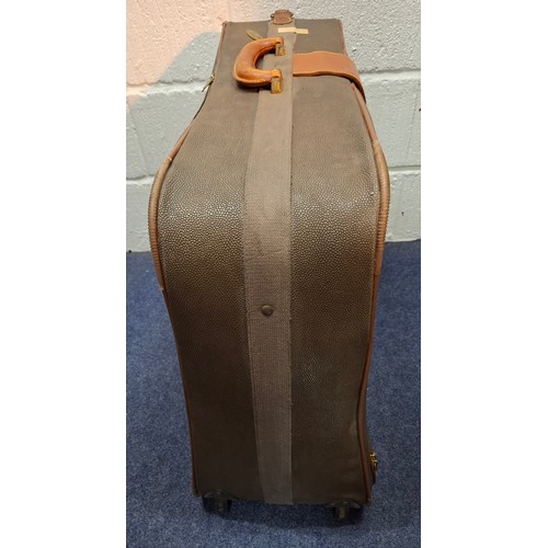 9 - Mulberry- A vintage suitcase in mole Scotchgrain and tan saddle leather trim and handles with wheels... 