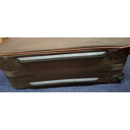 9 - Mulberry- A vintage suitcase in mole Scotchgrain and tan saddle leather trim and handles with wheels... 