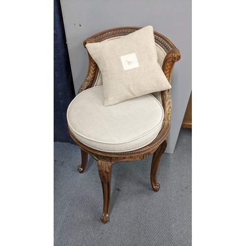 23 - A late 19th century French piano stool having a cared frame with a curved back, acanthus leaf carved... 