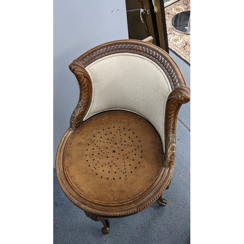 23 - A late 19th century French piano stool having a cared frame with a curved back, acanthus leaf carved... 