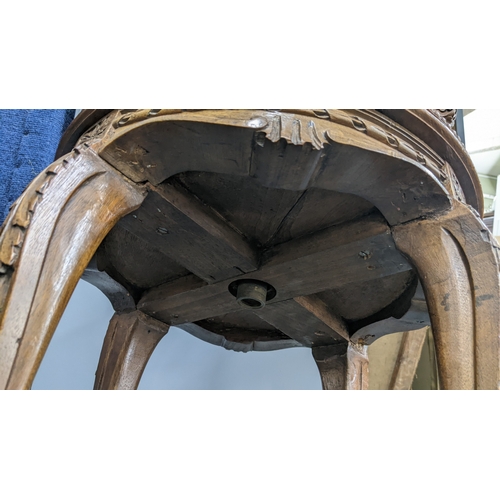 23 - A late 19th century French piano stool having a cared frame with a curved back, acanthus leaf carved... 