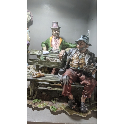 42 - A group of six Capodimonte ceramic figures to include four 'Tramp on a Bench' figures and others
Loc... 