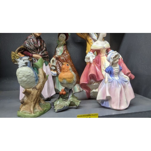 44 - Porcelain figures to include a Royal Doulton The Orange Lady figure, The Paisley Shawl, Votes for Wo... 