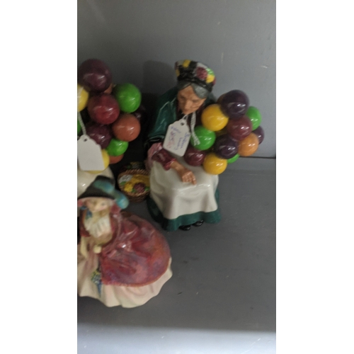 45 - A group of six Royal Doulton porcelain figures to include Balloon Lady, Balloon Man, Sticks and Ribb... 