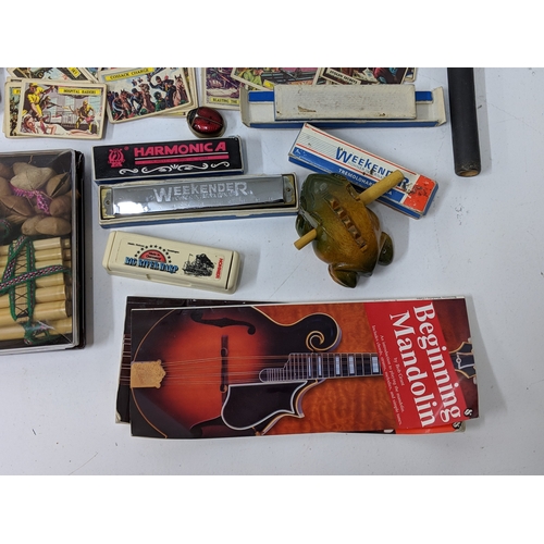 5 - A mixed lot to include cigarette cards, harmonicas, a monkey drum and other items
Location:GM
If the... 