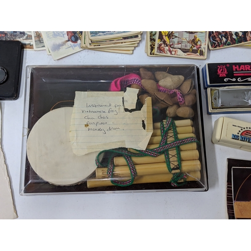 5 - A mixed lot to include cigarette cards, harmonicas, a monkey drum and other items
Location:GM
If the... 