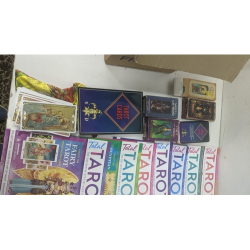 55 - A collection of tarot cards related items to include magazines, cards and other items Location: GM
I... 