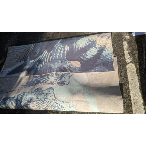 59 - A modern machine woven carpet having a blue and cream psychedelic design, 199cm x 303cm
Location: A3... 
