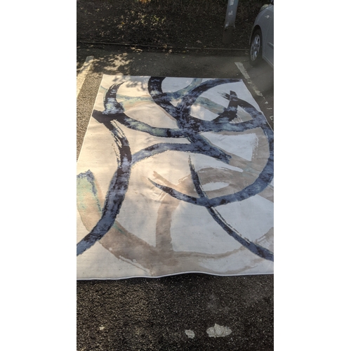 60 - A modern machine woven carpet having a blue and cream abstract design, 200cm x 300cm
Location: GR
If... 