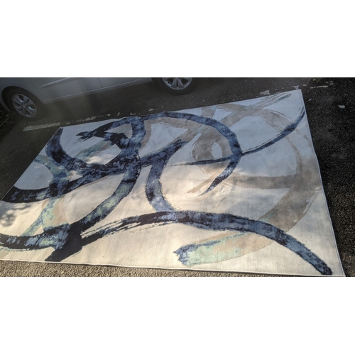 60 - A modern machine woven carpet having a blue and cream abstract design, 200cm x 300cm
Location: GR
If... 