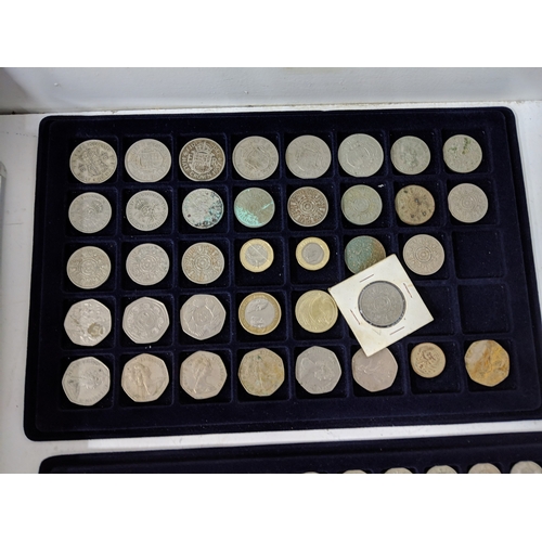 9 - Assorted coins, all British and displayed in coin trays to include pennies, five pence, two shilling... 
