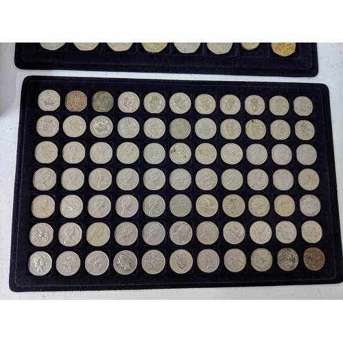 9 - Assorted coins, all British and displayed in coin trays to include pennies, five pence, two shilling... 