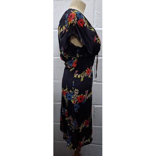 12 - Ossie Clark- A 1970's black knee length Summer dress supplied for Radley having a blue and red poppy... 