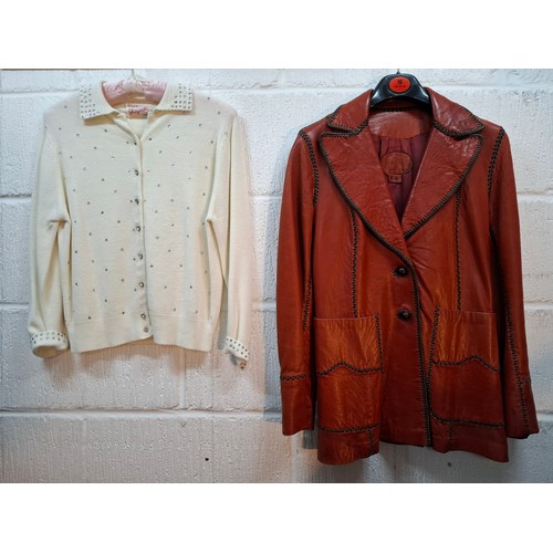 27 - Schiaparelle & Frank Usher- A white Schiaparelle cardigan with crystal buttons and accents having 4 ... 