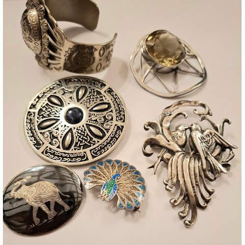 36 - A quantity of silver, pewter and white metal jewellery to include a St Justin pewter Celtic style br... 