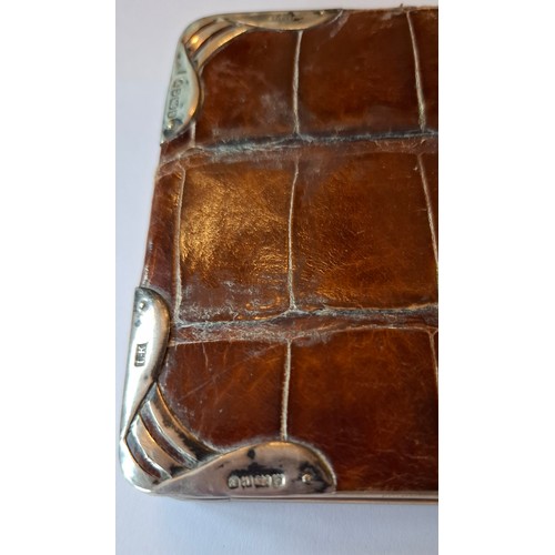 40 - A circa 1900's brown crocodile cigarette case A/F with silver frame and corners, makers mark LK (Lud... 