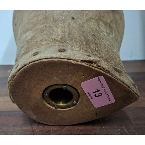13 - An early 20th Century cloth covered wooden milliners head with metal studs to base. Location: R2.1
I... 