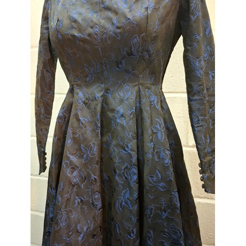 34 - A mid 20th Century blue brocade full length dress with gathered skirt and button cuffs, approx 32/34... 