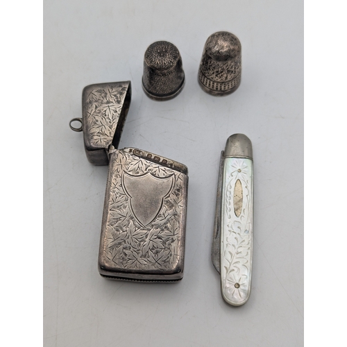 15 - Silver collectables to include an Edwardian vesta case with engraved decoration and central cartouch... 
