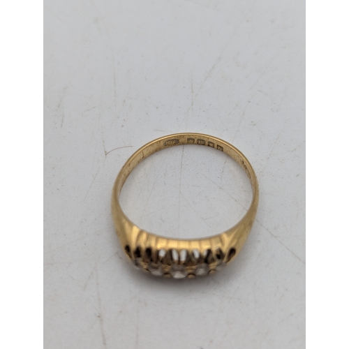 17 - An 18ct yellow gold and five stone diamond ring stamped 18 with British hallmarks, size L1/2, weight... 