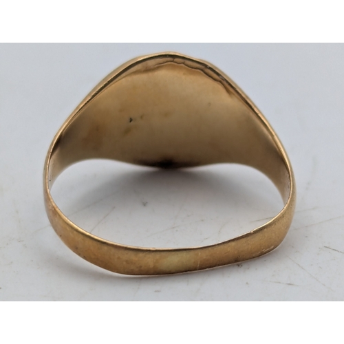 24 - A yellow metal signet ring with engraved initials tested as 9ct gold, weight 2.9g
Location: R1
If th... 
