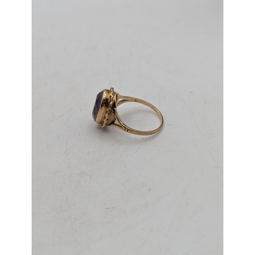 50 - A yellow metal and faceted cut amethyst dress ring tested as 9ct gold, size P1/2, weight 4.5g 
Locat... 